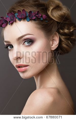 A woman with a wreath of flowers on her head