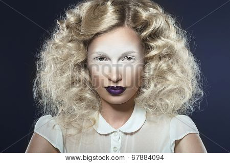 Art photo of beautiful girl with violet lips and pale eyes.