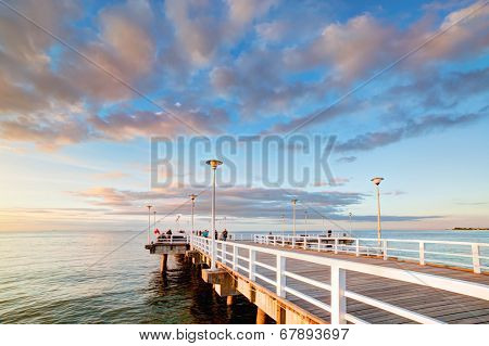 Beautiful retro pier at sunset over Baltic sea. Gdansk Brzezno, Poland