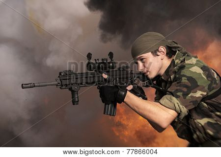 Portrait of the soldier with an automatic assault rifle