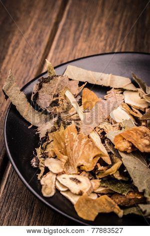 Chinese Traditional Herbs In The Black Plate.
