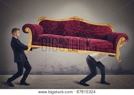Men carrying a sofa