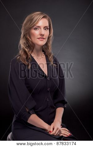 Young beautiful woman on a black background