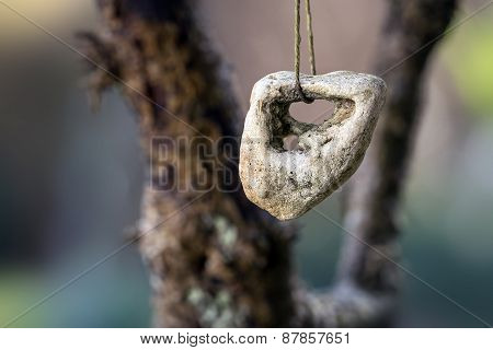 Stone With A Hole, Adder Stone Against  Blurred Background With Copyspace