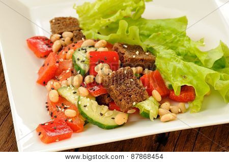 Vegetable Salad With White Beans, Rye Toasts, Tomatoes, Cucumber, Black Sesame Seeds And Letuce In S