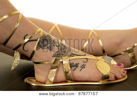 Woman In Egyption Sandles And Tattoo Legs Foot Close