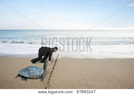 Businessman And Turtle Are Ready To Race On Sand Beach