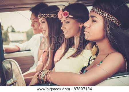 Multi-ethnic hippie friends on a road trip