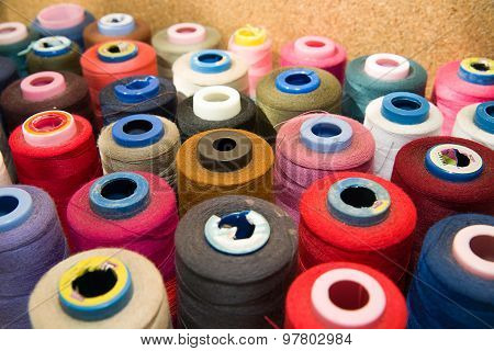 Many Reels Of  Threads Standing On The Table