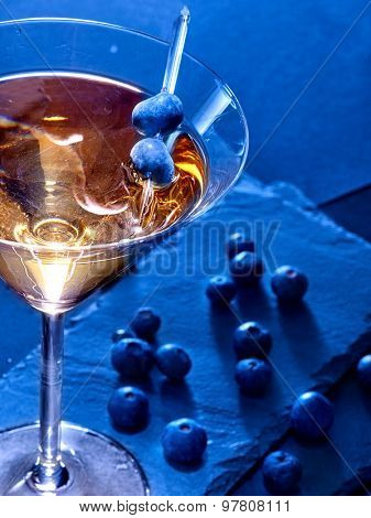 Blueberry gold drink on black background. Cocktail card 81