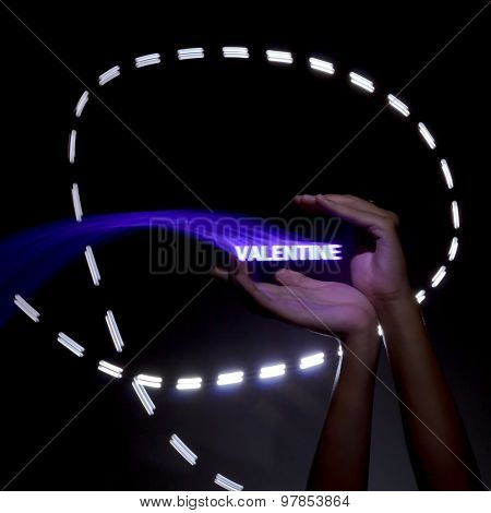 Light Painting Photography. Freezelight Photo. Hands Holding A Glowing Message With Freezelight Effe