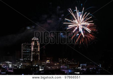 Fireworks lighting up above city at dark