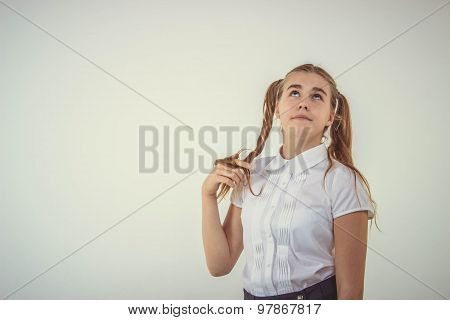 Schoolgirl thinking isolated on white background