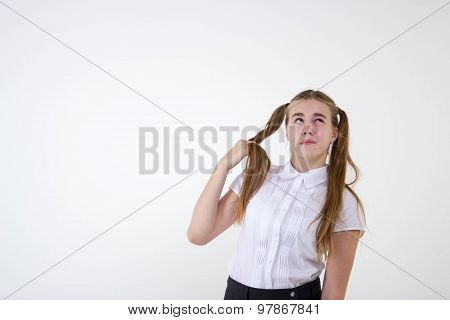 Schoolgirl thinking isolated on white background