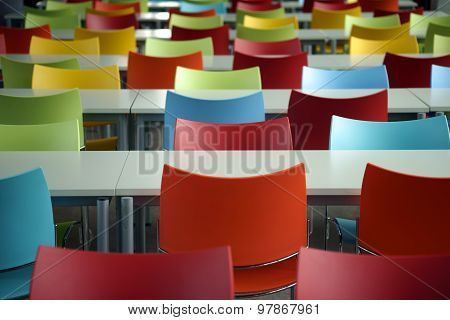 Rows of seats with colorful chairs