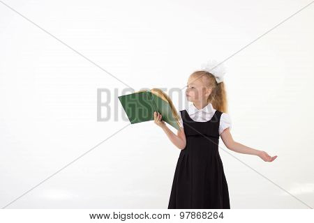 Little girl reading book, preparing for school