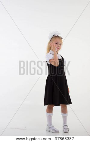 Schoolgirl with glasses standing worried