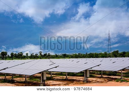 Solar Farm Natural Sky And Green Solar Panel.