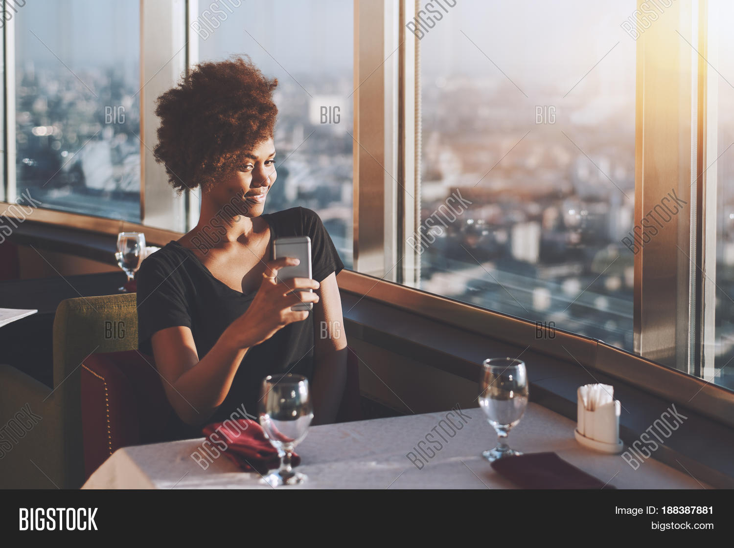 Naughty Curly Afro American Girl Is Sitting In Luxury Cafe On The Top Of Modern Skyscraper Naughty Curly Afro American Girl Is Sitting In Luxury Cafe On The Top Of Modern Skyscraper