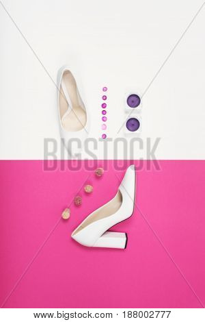 Shoes fashion. Stylish Trendy white heels on a pink background. Summer fashion Outfit, Luxury Party shoes. Minimal fashion concept.