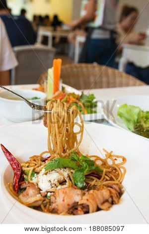 Thai spicy spaghetti with chili and pork