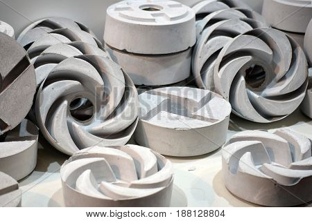 Pile of grindstones in various forms and sizes