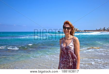 Happy Woman On The Beach Of The Mediterranean Sea