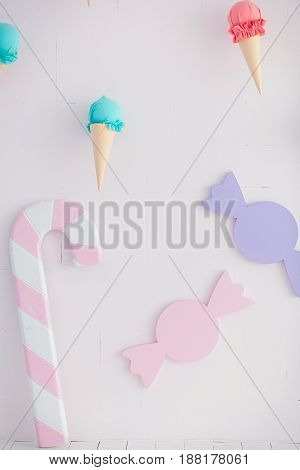 Children's zone with sweets: lollipops, ice cream and candy.