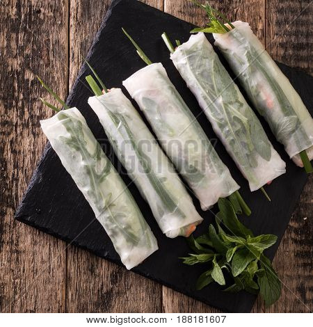 Delicious vietnamese spring roll with vegetable on dark background , healthy food
