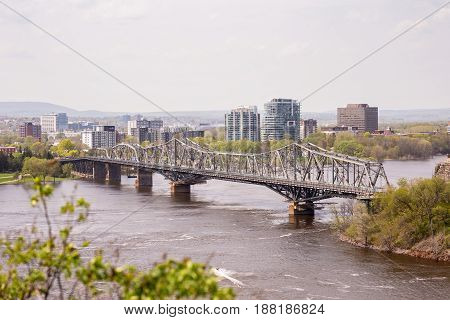 View of the Royal Alexandra Interprovincial Bridge spanning the Ottawa River between Ottawa, Ontario and Gatineau, Quebec. It is known locally as both the Alexandra  and the Interprovincial Bridge.