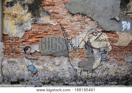 Street Art Titled Little Boy With Pet Dinosaur By Ernest Zacharevic