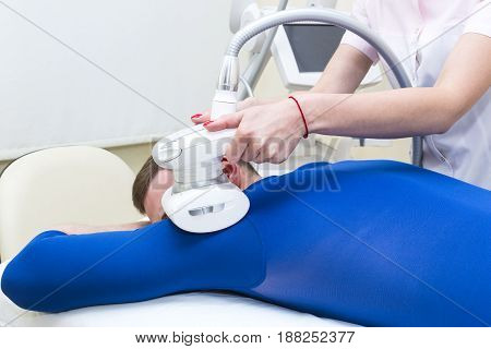 Male is in the process at the clinic lipomassage