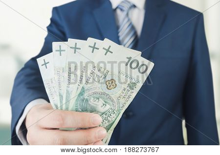 Range Of Polish Banknotes In Businessman Hand