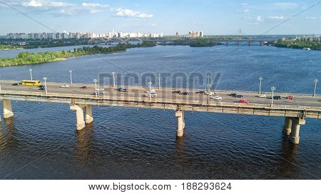 Aerial top view of Paton bridge and Dnieper river from above, city of Kiev, Ukraine