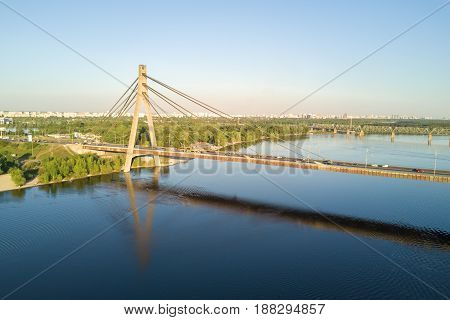 Aerial top view of Dnieper river and Moskovskiy bridge in city of Kiev, Ukraine