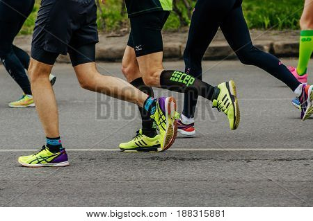 Ekaterinburg Russia - May 21 2017: side view group runners runs asphalt road in City half marathon
