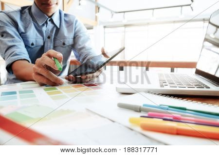 Creative Photographer Select Pictures And Using Computer To Working.