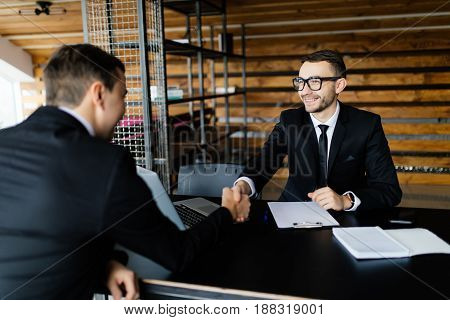 Sell Concept. Two Men Get An Agreement And Shake Hands.