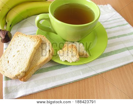 Tea, twice baked crisp bread and banana
