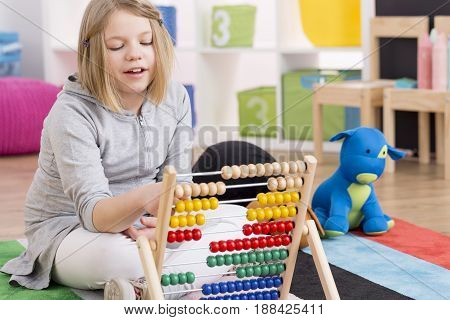 Genius Girl Playing With Abacus