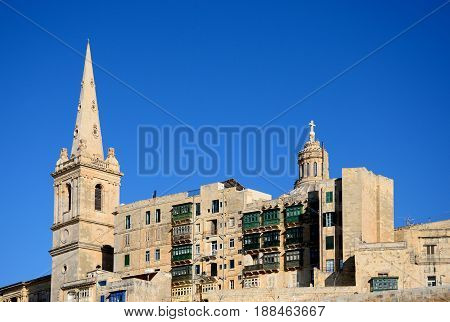 View of St Pauls Anglican Cathedral and the Basilica of Our Lady of Mount Carmel Valletta Malta Europe.