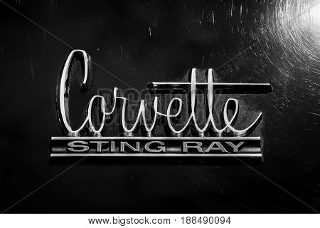 BERLIN GERMANY - MAY 17 2014: Emblem sports car Chevrolet Corvette Sting Ray (C2). Black and white. 27th Oldtimer Day Berlin - Brandenburg