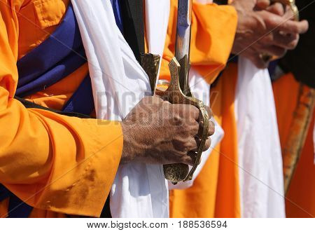 Hands Of A Sikh Elder Man Who Hold The Sword During Religious Fu