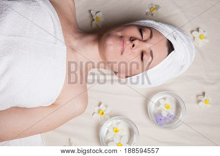 beautiful woman lies in the sauna spa relax massage