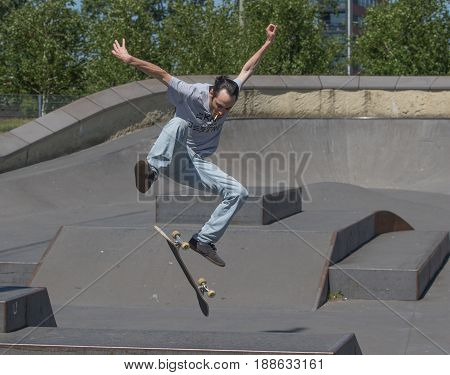 A skateboarder executing a kickflip in the air