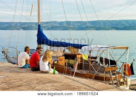 Omis Croatia - August 17 2016: Friends relaxing on the Boat at the harbor in the Adriatic Sea Omis Croatia