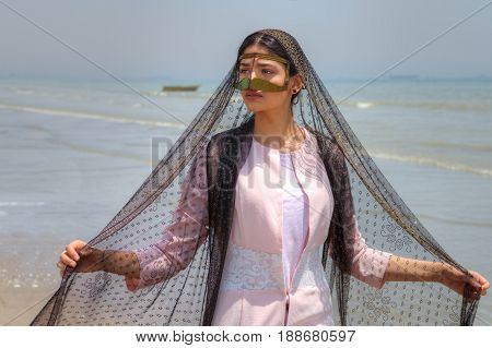 Bandari woman wears a traditional mask beach of Persian Gulf Hormozgan province southern Iran.