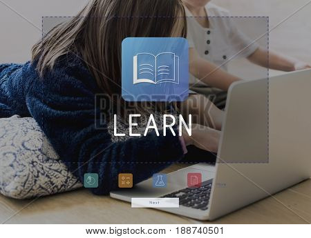 Kids playing games using tablet and laptop