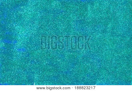 Background made of mermaid blue glitter nail polish and blue craft foam