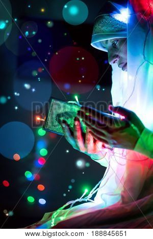 Muslim woman praying in dark room with nice lights around her